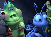 A ladybug, caterpillar, spider, ant, and praying mantis look with wide eyes at another ant.