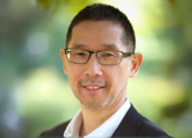 A headshot of Sanford Ikeda