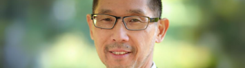 A headshot of Sanford Ikeda